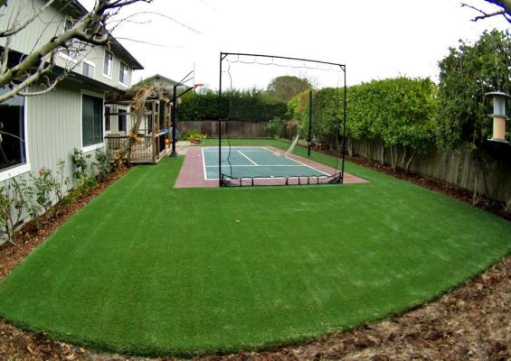 Sport court surrounded by artificial grass