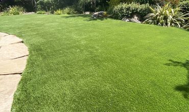 Artificial grass playground in backyard